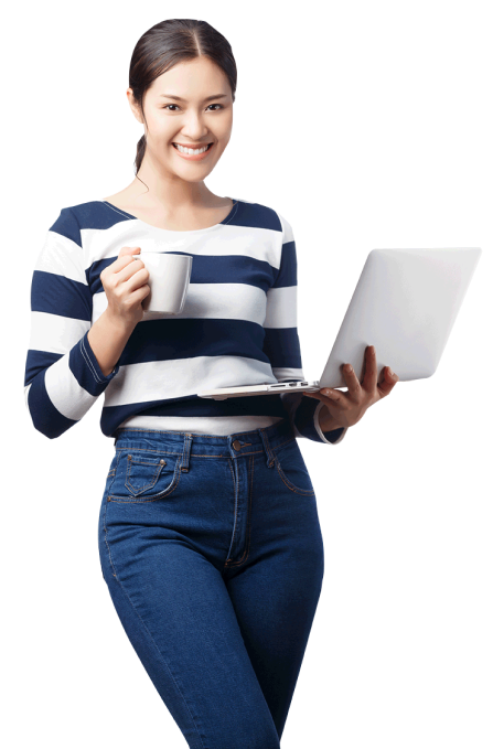 A young professional woman in a striped shirt and jeans, holding a coffee mug in one hand and her laptop in the other